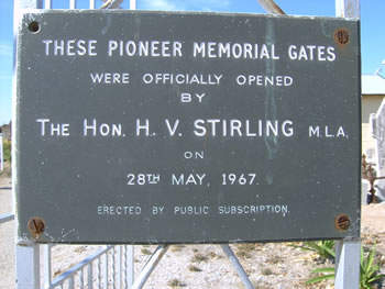 dedication plaque on cemetery gates
