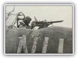 Near Merauke, Dutch New Guinea. 1943-12-23. The defensive end of a Vultee Vengeance dive-bomber aircraft of No. 12 Squadron RAAF based at Merauke. Flight Sergeant H.J. Ross of Leeton, NSW, manning twin guns, with armour plate protection, in the rear compartment.