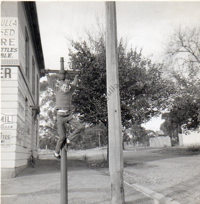Subject unknown, hanging on to lamp post outside Buchanan’s General Store in Tarnagulla C1966